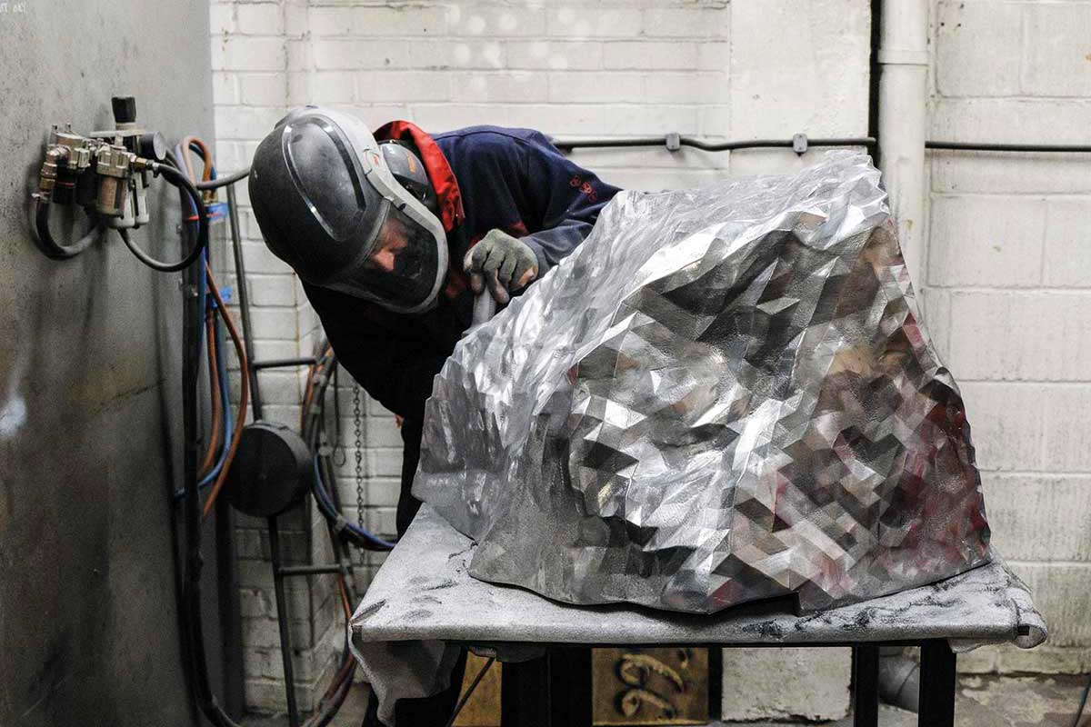 Faceted aluminium rock sculpture